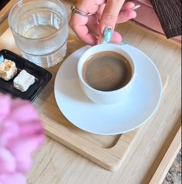Turkish coffee with water and a sweet